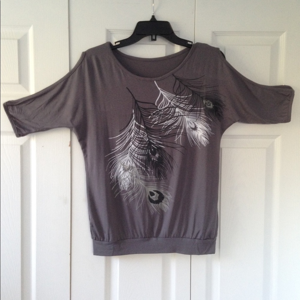 Graphic design cold shoulder tee.
